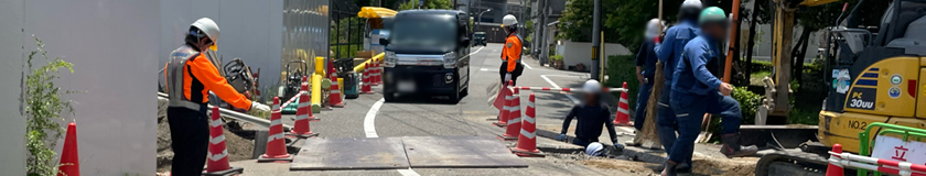 尼崎市のガス管取替工事現場での交通誘導警備中の警備員1(2024.06.11)